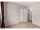 Cozy bedroom with neutral walls, carpet, and a closet perfect for storage at 7365 W Magdalena Ln, Laveen, AZ 85339