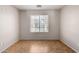 Versatile empty room with tile flooring and a large window, ready to be customized to your needs at 7365 W Magdalena Ln, Laveen, AZ 85339