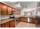 Well-equipped kitchen with stainless steel appliances and ample cabinet space, perfect for cooking and entertaining at 7365 W Magdalena Ln, Laveen, AZ 85339