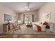 Bright living room with a ceiling fan, sliding glass doors to the backyard, and stylish furnishings at 7365 W Magdalena Ln, Laveen, AZ 85339