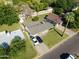 Aerial view of the home showcasing the well-manicured lawn, driveway, and surrounding neighborhood at 7719 N 17Th Ave, Phoenix, AZ 85021