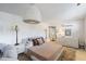 Comfortable bedroom featuring a queen-size bed, modern lighting, and ample storage at 7719 N 17Th Ave, Phoenix, AZ 85021