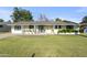 Charming single-story home featuring a well-manicured lawn and a welcoming front porch at 7719 N 17Th Ave, Phoenix, AZ 85021