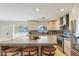 Modern kitchen showcasing ample cabinetry, updated appliances, and an oversized island with breakfast bar at 7719 N 17Th Ave, Phoenix, AZ 85021