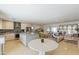 Open floor plan featuring a kitchen, dining space, and living area with natural light at 7719 N 17Th Ave, Phoenix, AZ 85021
