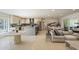Open-concept living space featuring a kitchen, dining area, and comfortable seating at 7719 N 17Th Ave, Phoenix, AZ 85021