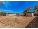 Large backyard features both a pool and the back of the house at 7746 W Osborn Rd, Phoenix, AZ 85033