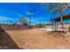 Backyard has a pool, block fence, and partial shade at 7746 W Osborn Rd, Phoenix, AZ 85033