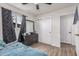 Bedroom features a window, closet, and adjacent door at 7746 W Osborn Rd, Phoenix, AZ 85033