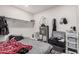 Bedroom features a shelf, hot water heater, and window at 7746 W Osborn Rd, Phoenix, AZ 85033