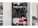 Walk-in closet with shelving, hanging racks, and an organized storage system at 7746 W Osborn Rd, Phoenix, AZ 85033