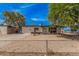 Charming single-story home featuring a low fence and gravel landscaping for easy maintenance at 7746 W Osborn Rd, Phoenix, AZ 85033