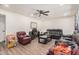 Spacious living room featuring tile floors, a ceiling fan and lots of seating at 7746 W Osborn Rd, Phoenix, AZ 85033