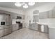 Modern kitchen with gray cabinets, stainless steel appliances, and an open layout at 7924 W Hammond Ln, Phoenix, AZ 85043