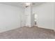 Spacious carpeted main bedroom with multiple doors and passageways at 7924 W Hammond Ln, Phoenix, AZ 85043