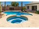 Backyard featuring a pool and spa with desert landscaping at 7924 W Hammond Ln, Phoenix, AZ 85043