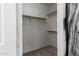 Empty walk-in closet with rods for hanging clothes at 7924 W Hammond Ln, Phoenix, AZ 85043