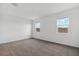 A spacious bedroom with carpet flooring and bright natural light at 8474 W Clemente Way, Florence, AZ 85132