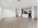 Spacious living room with tile flooring, flowing into adjacent kitchen at 8474 W Clemente Way, Florence, AZ 85132