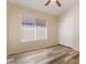 Bedroom with wood floors, a ceiling fan and closet at 10226 E Pine Valley Rd, Scottsdale, AZ 85255