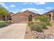Inviting single-story home with a desert-landscaped front yard and two car garage at 10226 E Pine Valley Rd, Scottsdale, AZ 85255