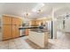 Sunlit kitchen features granite counters, stainless appliances, and an island at 10226 E Pine Valley Rd, Scottsdale, AZ 85255