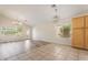 Open living area featuring stylish lighting, tiled flooring, and large windows at 10226 E Pine Valley Rd, Scottsdale, AZ 85255