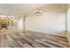 Open-concept living room featuring stylish wood flooring and a modern chandelier at 10226 E Pine Valley Rd, Scottsdale, AZ 85255