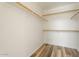 Walk-in closet with rod and shelves for optimal storage at 10226 E Pine Valley Rd, Scottsdale, AZ 85255