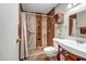 Bathroom featuring a tiled walk-in shower, built-in wall storage and modern fixtures at 10643 W Pineaire W Dr, Sun City, AZ 85351