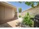 Private courtyard with brick accents, mature plants, brick wall and BBQ perfect for outdoor relaxation at 10643 W Pineaire W Dr, Sun City, AZ 85351