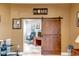 Bright office space with sliding barn door, wooden desk and stylish decor at 10643 W Pineaire W Dr, Sun City, AZ 85351