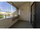 A private balcony overlooks the community, offering a peaceful outdoor retreat with shade at 11026 N 28Th Dr # 34, Phoenix, AZ 85029