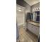 Bathroom with granite counters, white cabinets, tub and shower combo at 11026 N 28Th Dr # 34, Phoenix, AZ 85029