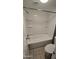 Bathroom with a bathtub, shower, toilet, and white tiled walls at 11026 N 28Th Dr # 34, Phoenix, AZ 85029