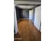 Spacious bedroom featuring wood floors, grey walls, and white trim at 11026 N 28Th Dr # 34, Phoenix, AZ 85029