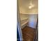 Walk-in closet with white shelving and wood floors at 11026 N 28Th Dr # 34, Phoenix, AZ 85029