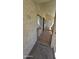 Charming condo exterior with textured walls, a private gate, and a window with natural light at 11026 N 28Th Dr # 34, Phoenix, AZ 85029