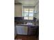 This kitchen features granite countertops, a stainless steel dishwasher, and a window over the sink at 11026 N 28Th Dr # 34, Phoenix, AZ 85029