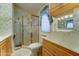 Cozy bathroom featuring a glass shower, vanity, and medicine cabinet at 111 S Greenfield Rd # 467, Mesa, AZ 85206