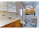 Functional bathroom/laundry combo with updated sink, toilet, and appliances at 111 S Greenfield Rd # 467, Mesa, AZ 85206