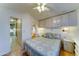 Cozy bedroom with a queen bed, built-in cabinets, and neutral decor at 111 S Greenfield Rd # 467, Mesa, AZ 85206