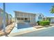 Charming single-story home with a covered patio and well-maintained landscaping at 111 S Greenfield Rd # 467, Mesa, AZ 85206