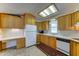 Bright kitchen with ample cabinets, white appliances, and modern countertops at 111 S Greenfield Rd # 467, Mesa, AZ 85206