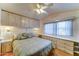 Bedroom featuring built-in cabinets and drawers, plus a ceiling fan at 111 S Greenfield Rd # 467, Mesa, AZ 85206