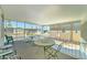 Relaxing screened patio with outdoor furniture and a view of the community at 111 S Greenfield Rd # 467, Mesa, AZ 85206