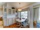 Eat-in kitchen featuring cabinetry and a cozy dining table and chairs at 111 S Greenfield Rd # 531, Mesa, AZ 85206