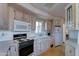Efficient kitchen with appliances, neutral countertops, and ample storage space for cooking essentials at 111 S Greenfield Rd # 531, Mesa, AZ 85206