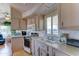 Functional kitchen featuring a stove, microwave, ample cabinetry, and a sink with a view at 111 S Greenfield Rd # 531, Mesa, AZ 85206