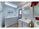 Bright laundry room with washer, dryer, sink, and a door to the outside at 111 S Greenfield Rd # 531, Mesa, AZ 85206
